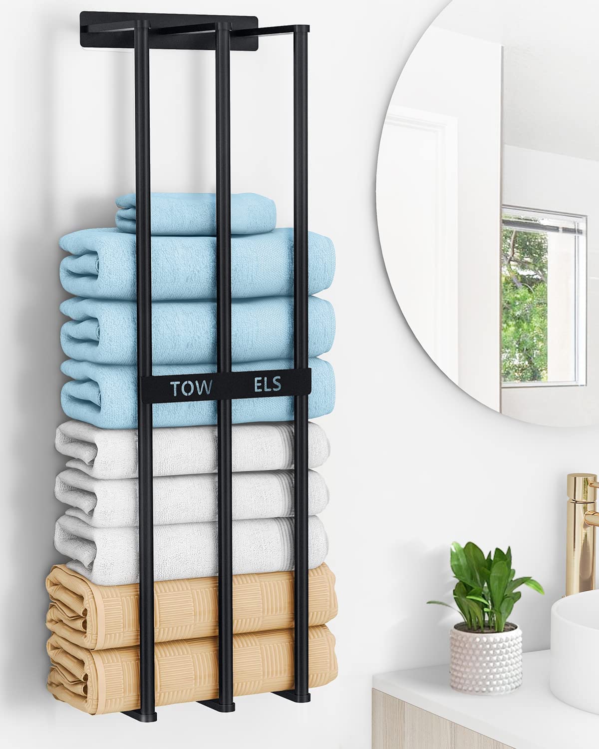 a towel storage that is fixed to the wall and that can store multiple towels is a great addition to a bathroom in need of vertical storage solution while freeing the floor space