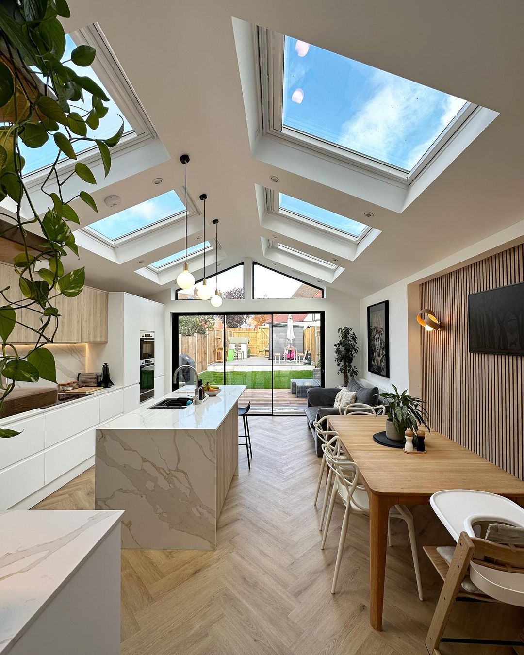 kitchen with multiple skylights provide ample natural light to create a unique indoor experience