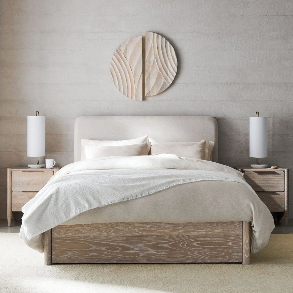 a bedroom decorated in neutral color and wood furniture make this minimalist bedroom a serene and a beautiful space to be in.