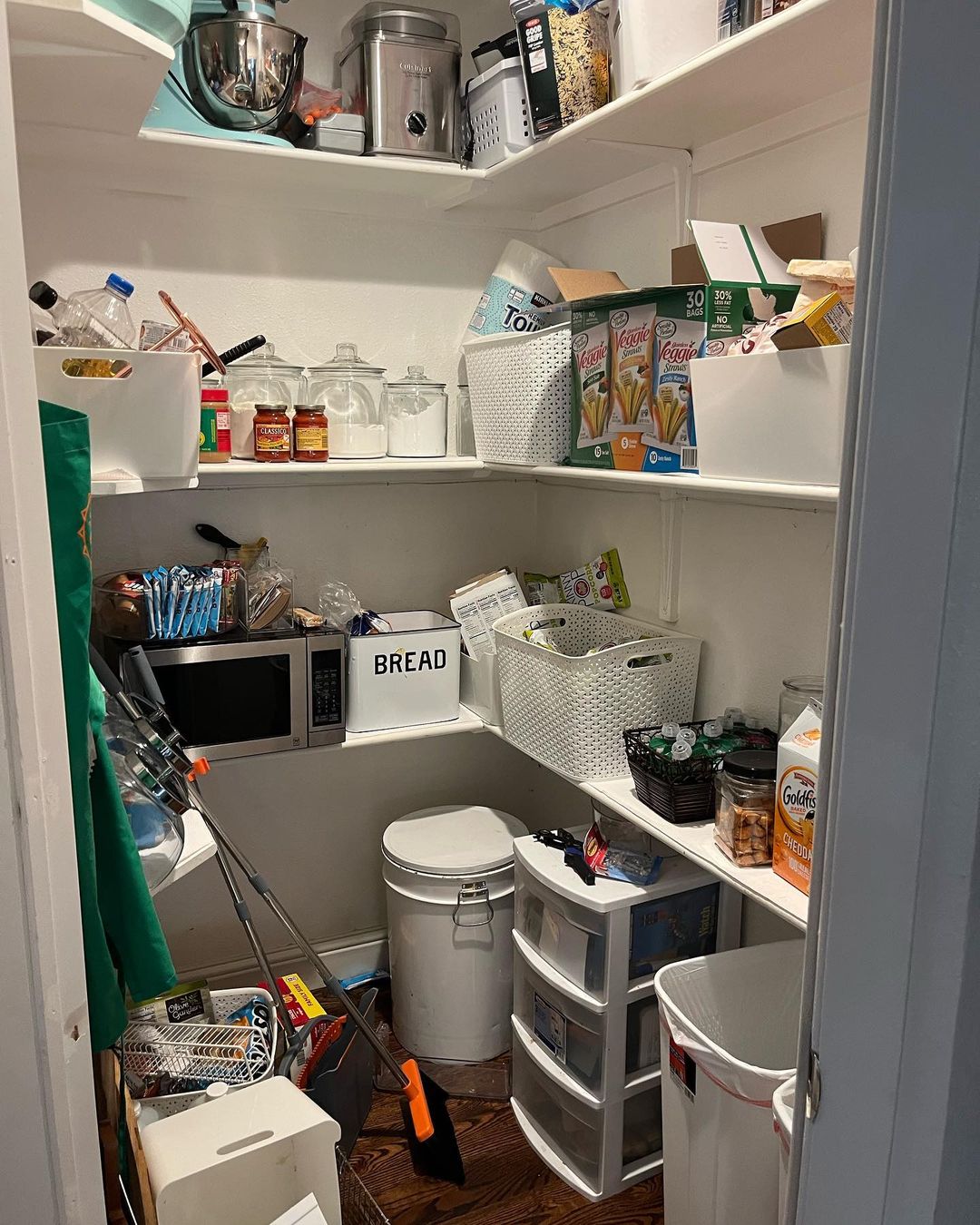 A pantry cluttered with many items in an untidy manner can use more organization tips