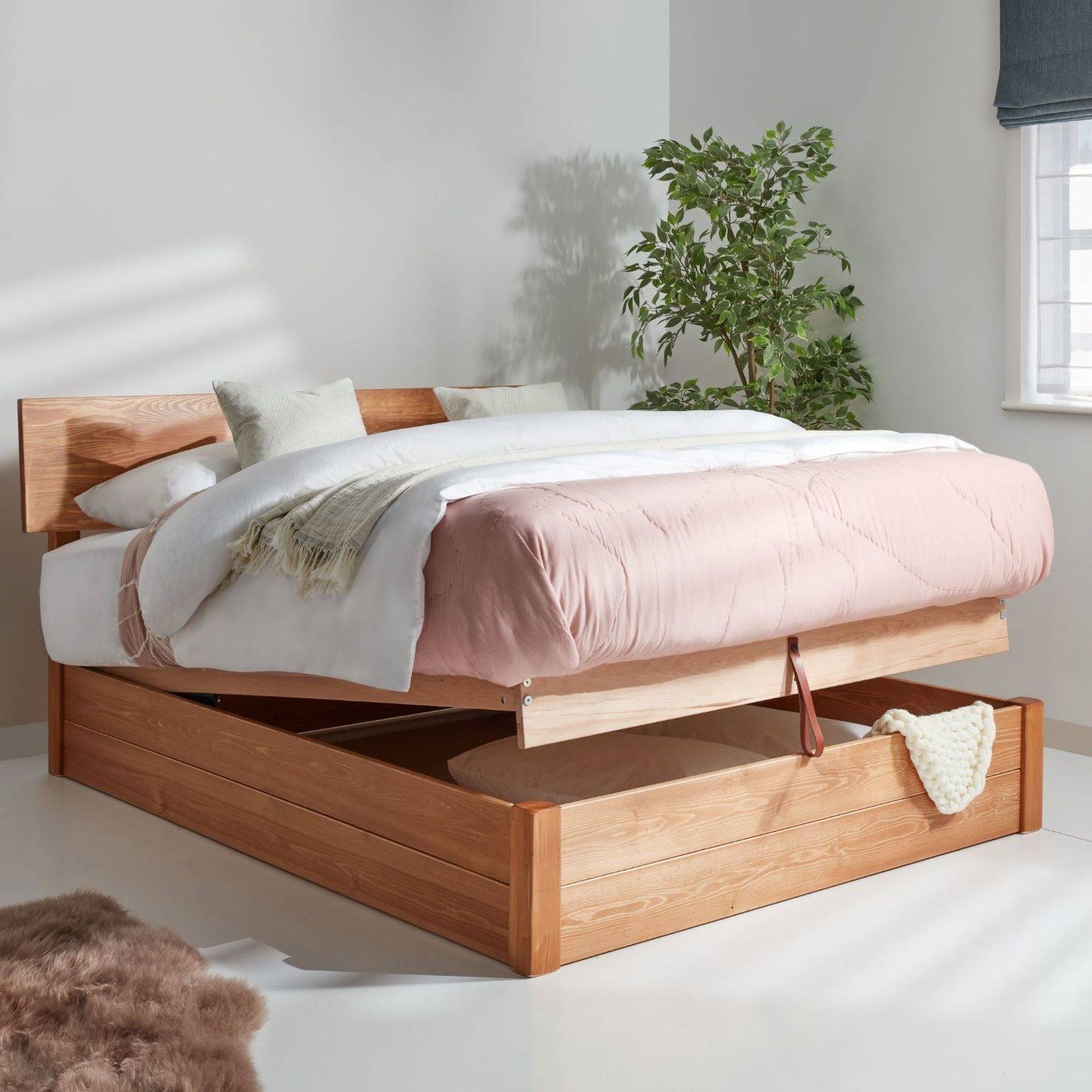 a bed with storage underneath provides clever storage solutions for a more efficient home.