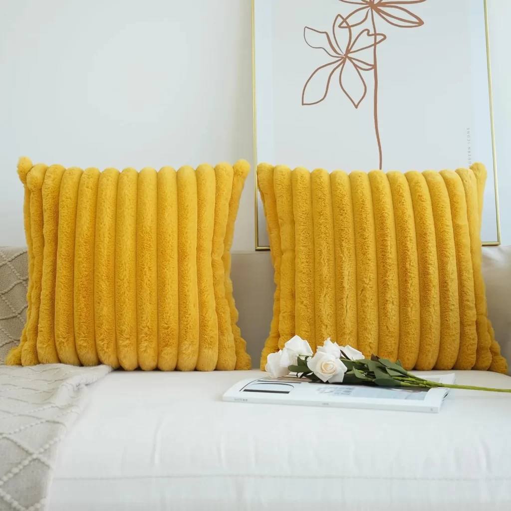 mustard faux fur decorative pillow covers are eye-catchy and great at adding color and warmth to any couch in the cold winter season.