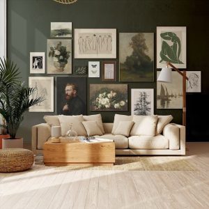 A cozy living room featuring a beige sofa, wooden coffee table, and a wall adorned with vintage framed artworks, complemented by indoor plants and a green wall.