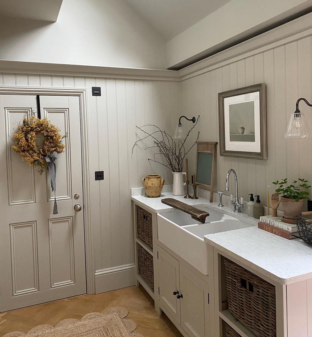 Light and bright color scheme for a long narrow laundry room is an effective way to create a sense of openness and make the room more comfortable to use.