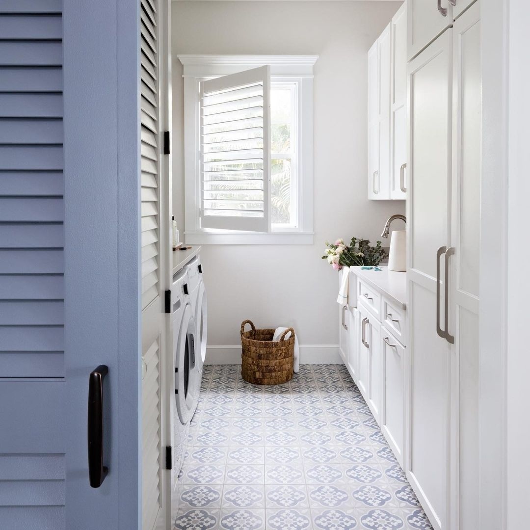 Another great way to maximize space in a long narrow laundry room is to capitalize on natural lighting by installing a tall window on an outside wall.