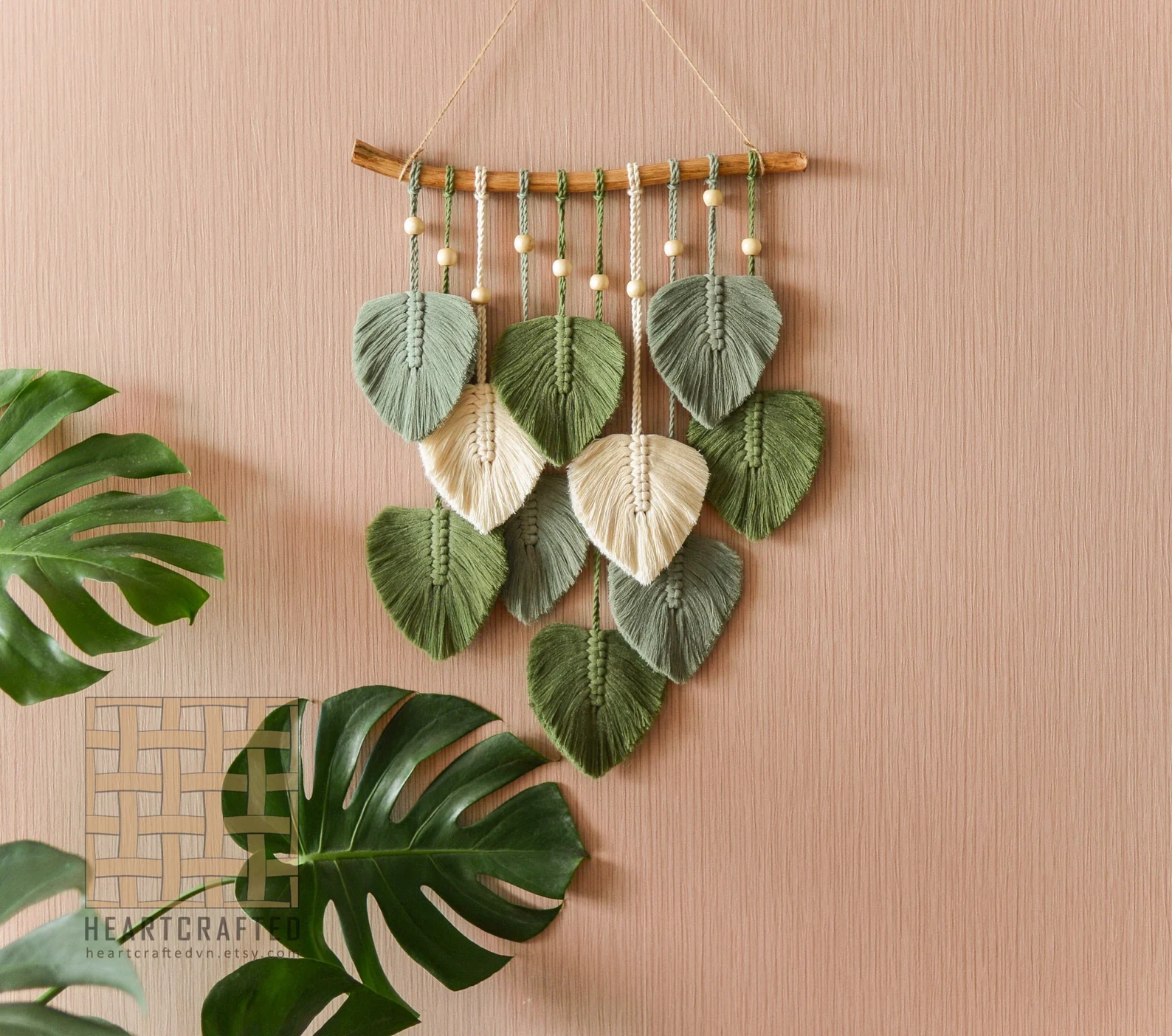 Macrame Leaf Wall Hanging on a solid colored wall in the boho style