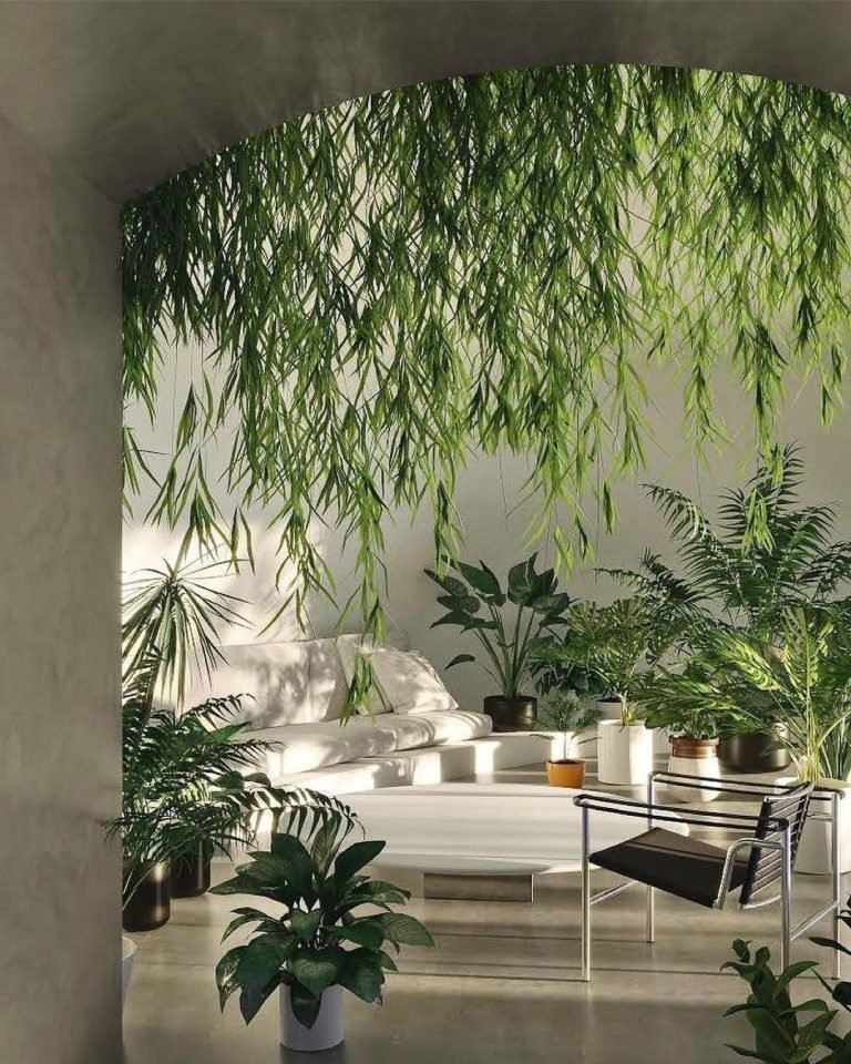 A sunlit room with hanging and potted green plants, a white lounge chair, a black metal chair, and a coffee table with small items showcases techniques from "Beyond Color: Unconventional Techniques for Uplifting Your Home's Vibe.