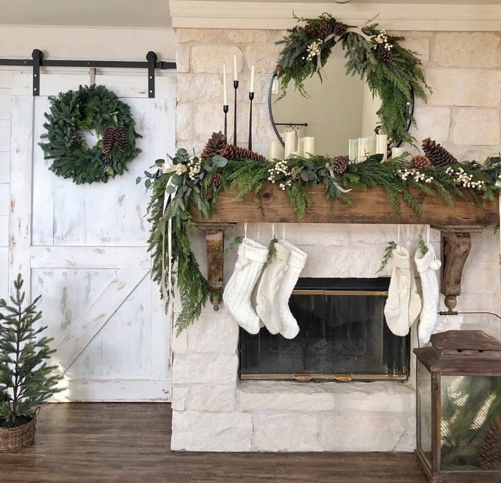 winter holiday decor idea over a mantel in a modern rustic home