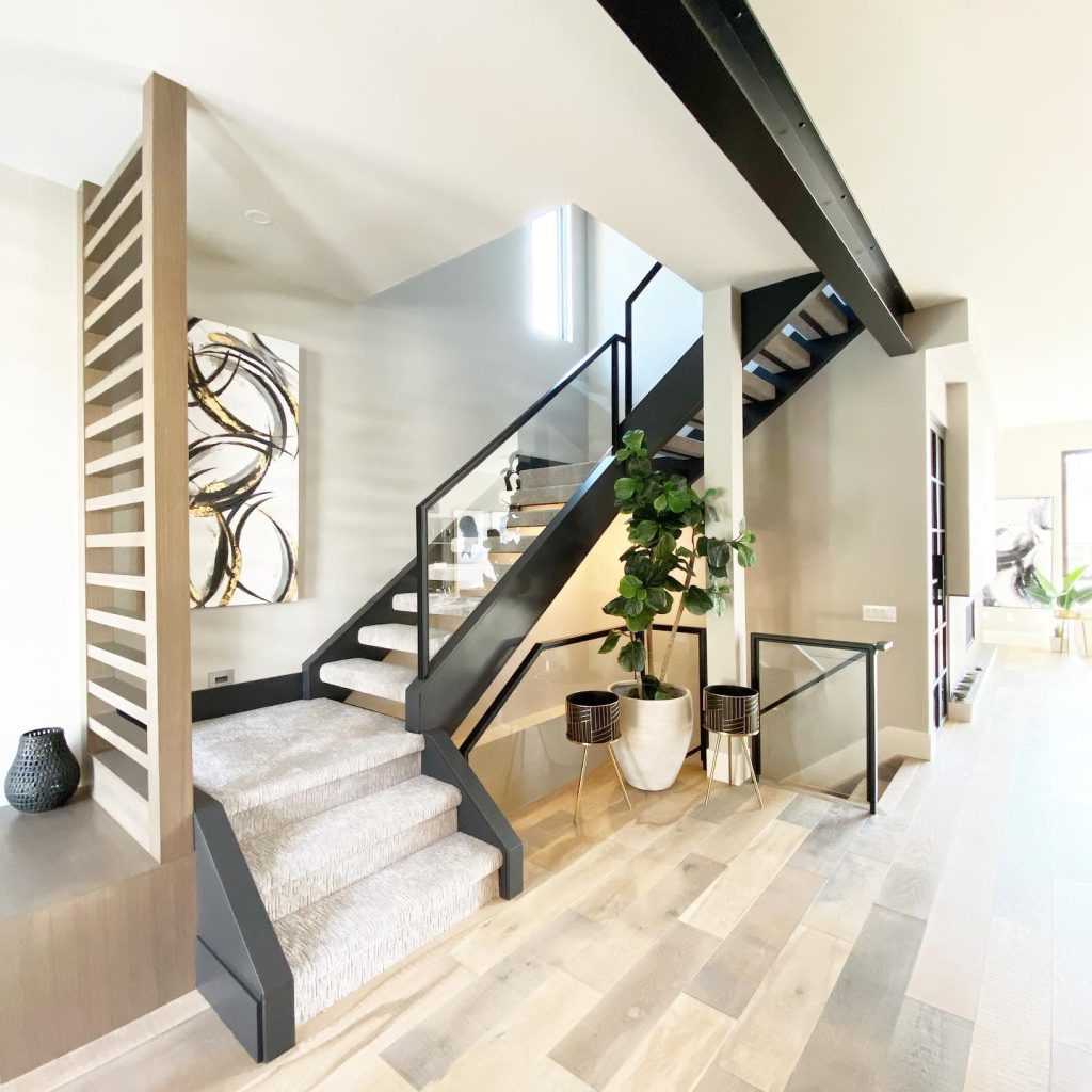 an industrial style metal stair in an airy home interior space
