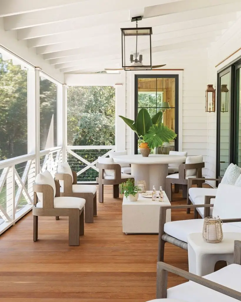 relaxing porch with outdoor furniture including seatings and a coffee table