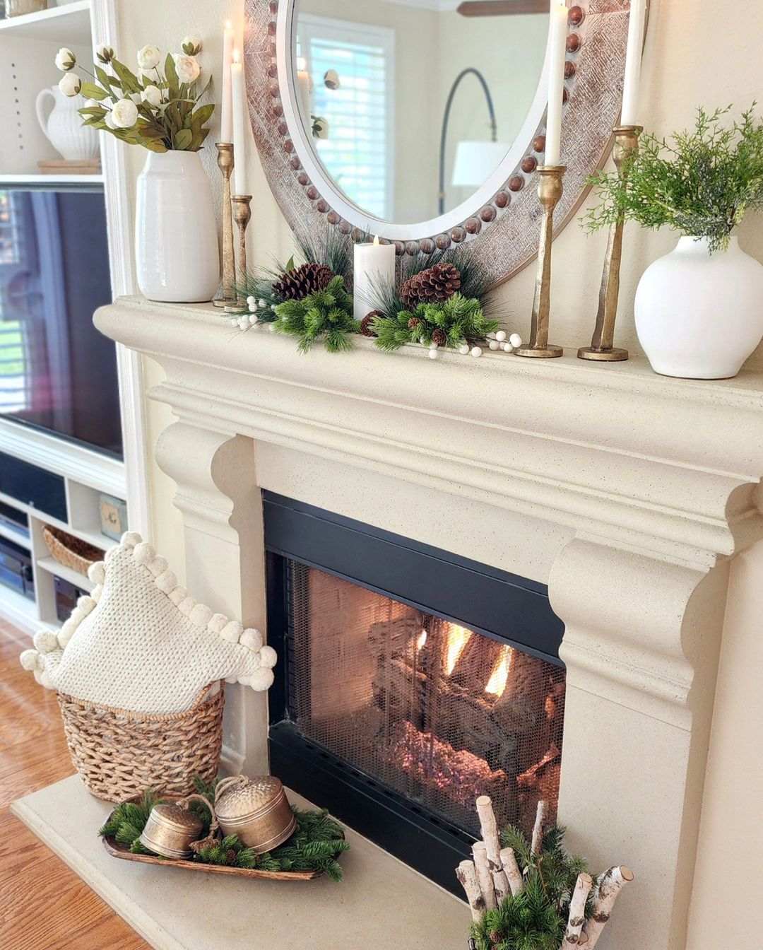 mantel decor with seasonal accents such as birch and pinecones enhances this fireplace and mantel for the winter season