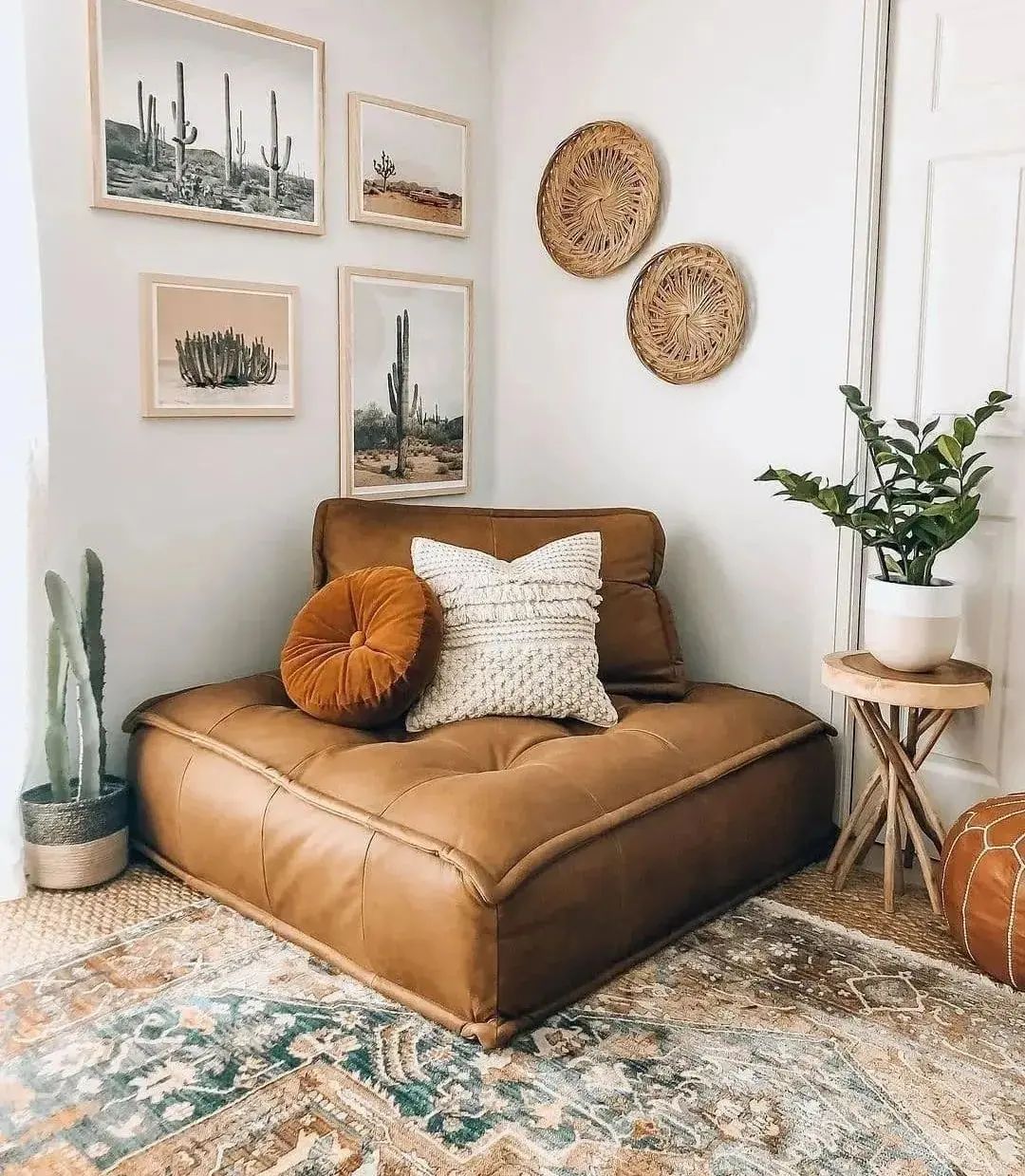 corner seating decorated with throw pillows, potted plants, wall basket decor and wall art in the Bohemian style