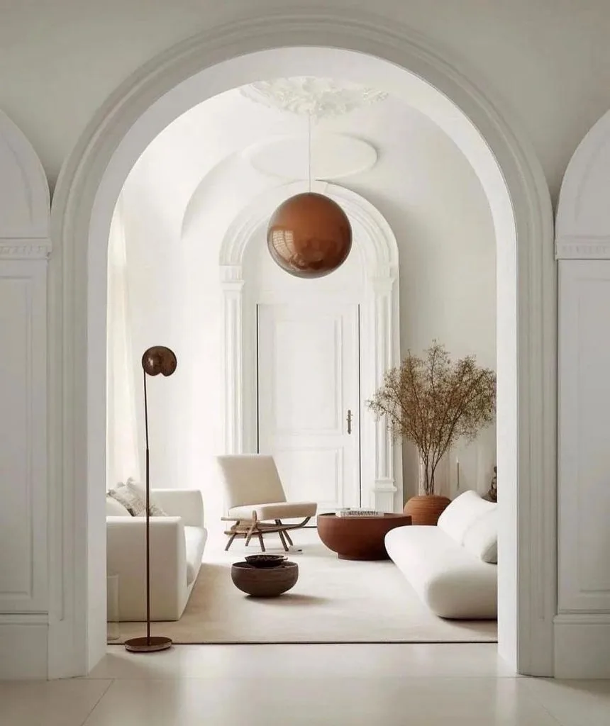 interior of a minimalist living space with a neutral color palette and minimalist furniture