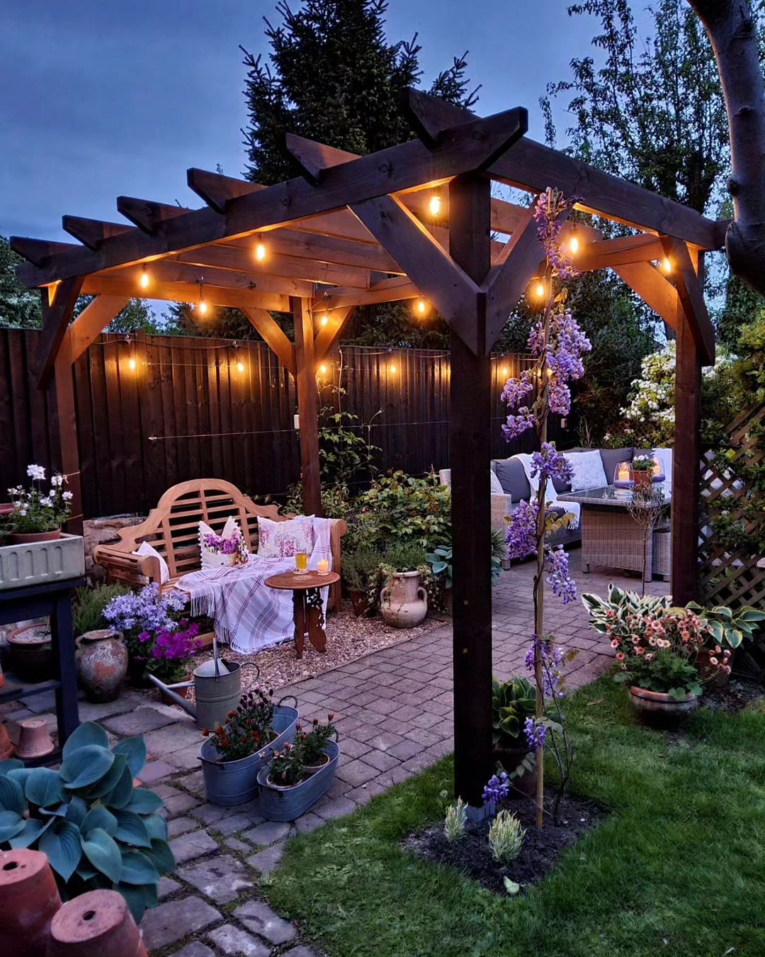 night time gazebo with suspended lights make this garden a beautiful and inviting outdoor spot for relaxation