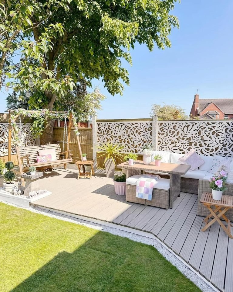 outdoor furniture including a swing is perfect to enjoy the Spring season as in this decorated backyard garden space.