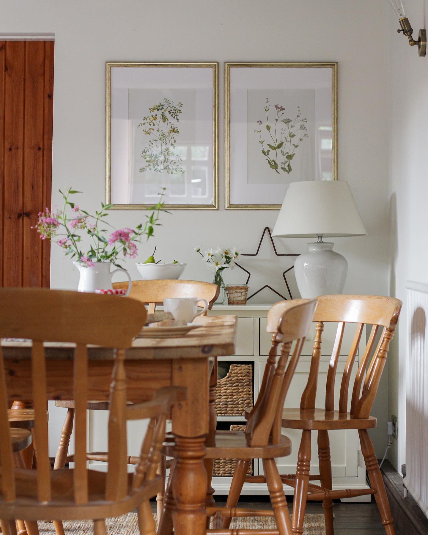 cottage style dining room with wooden chairs and dining table 
