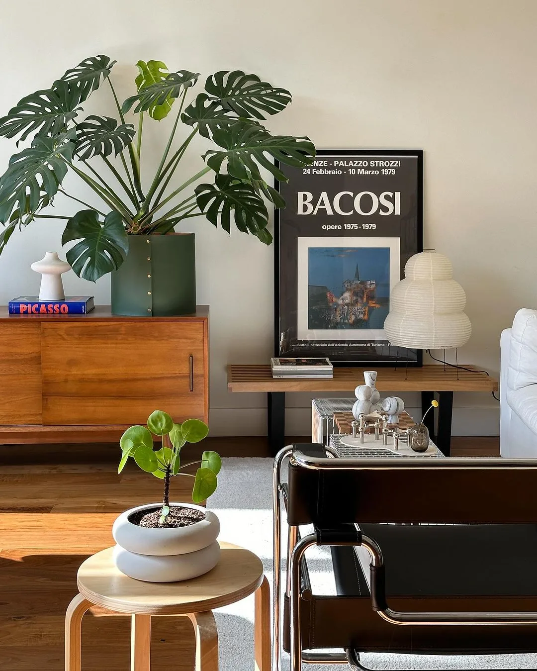 use a few green leafy potted plants to revive the vibe of your living room like in this one