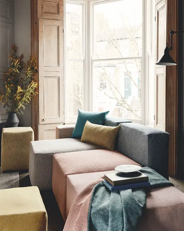 enriched by an uplifting palette and incorporating recycled yarns, a beautifully soft, cotton plain resides restfully against relaxed weaves in this living room couch styling