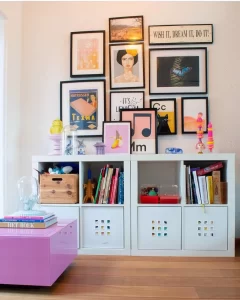 the use of framed artwork in various sizes and displaying different art styles can easily enhance an eclectic wall decor.