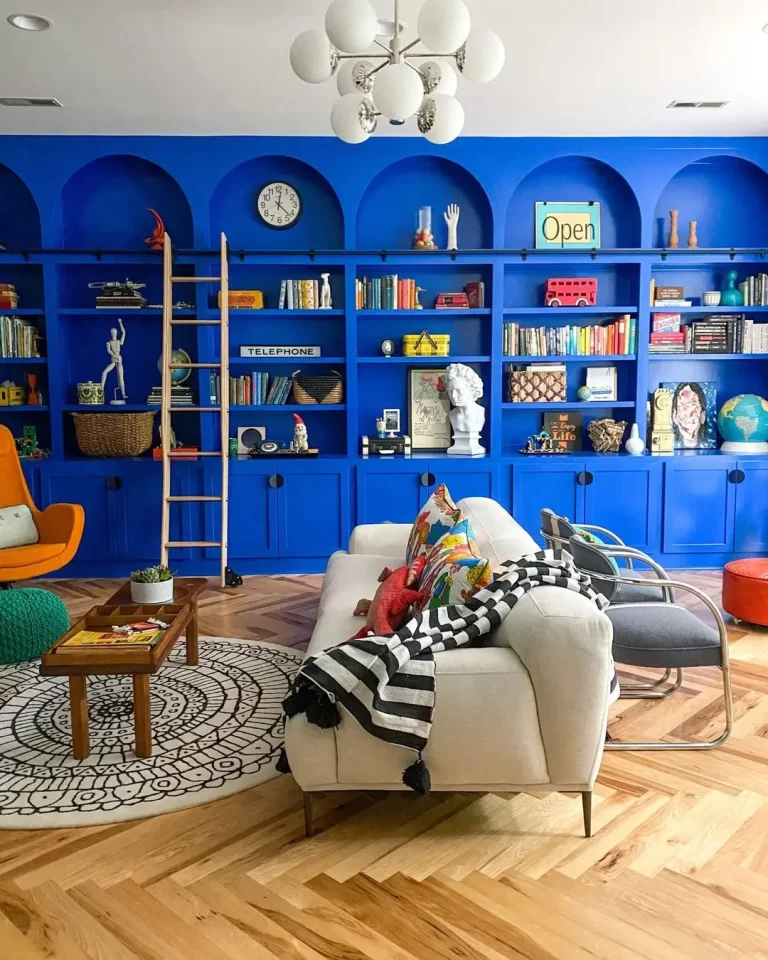 a bold custom built-in wall cabinet adds a dramatic effect to this funky living room.