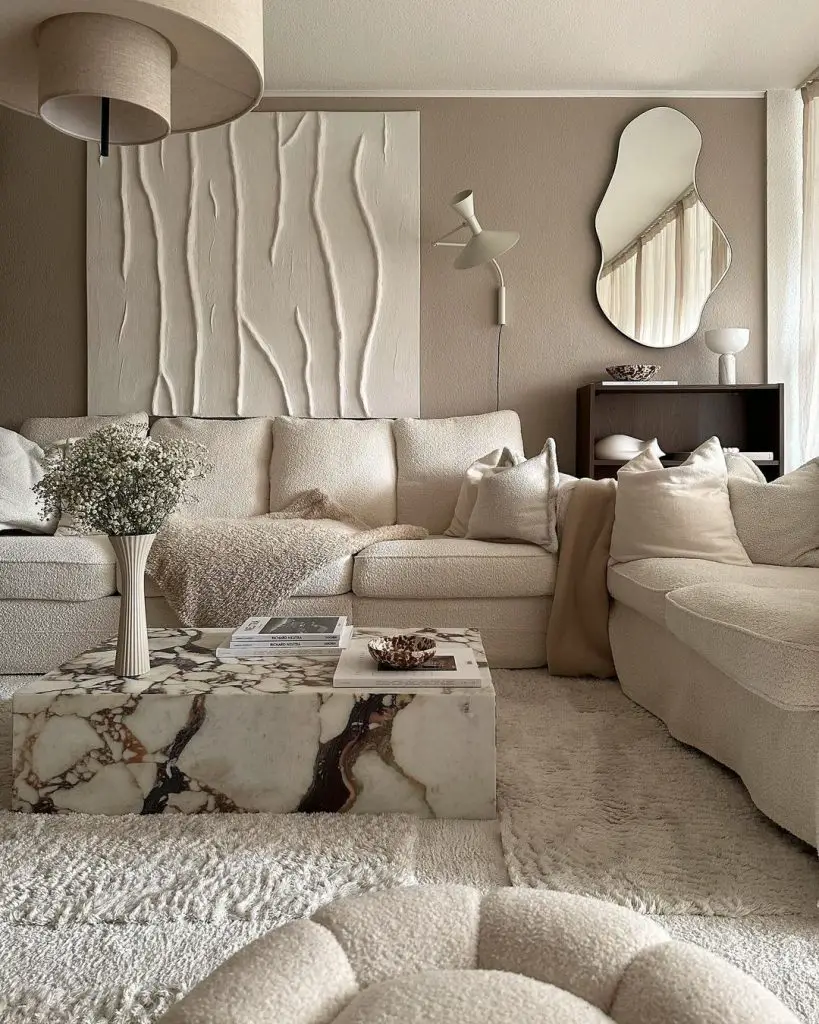 a minimalist living room with neutral color scheme and matching wall art to the overall decor is an easy way to avoid common decor mistakes an ideal for a first home approach.