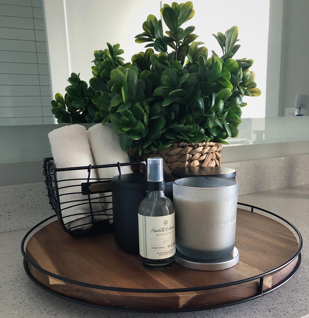 a tray styled with a small wire basket and other decor items is an easy way to update your decor between seasons such as from winter to spring.