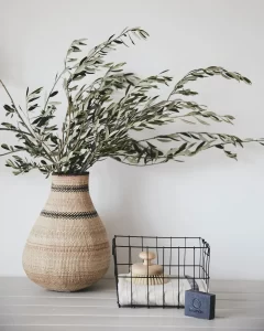 a wire basket can be a great way to keep the bathroom organized such as holding a towel and brush as in this example.