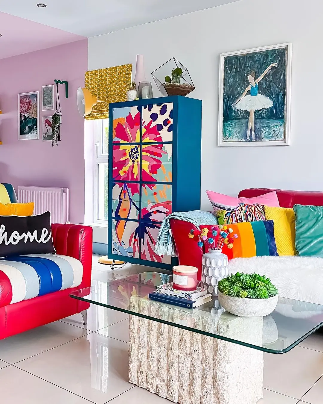 funky decor trend 2024 likely include colorful sofas, throw pillows, and living room cabinet such as in this living room.