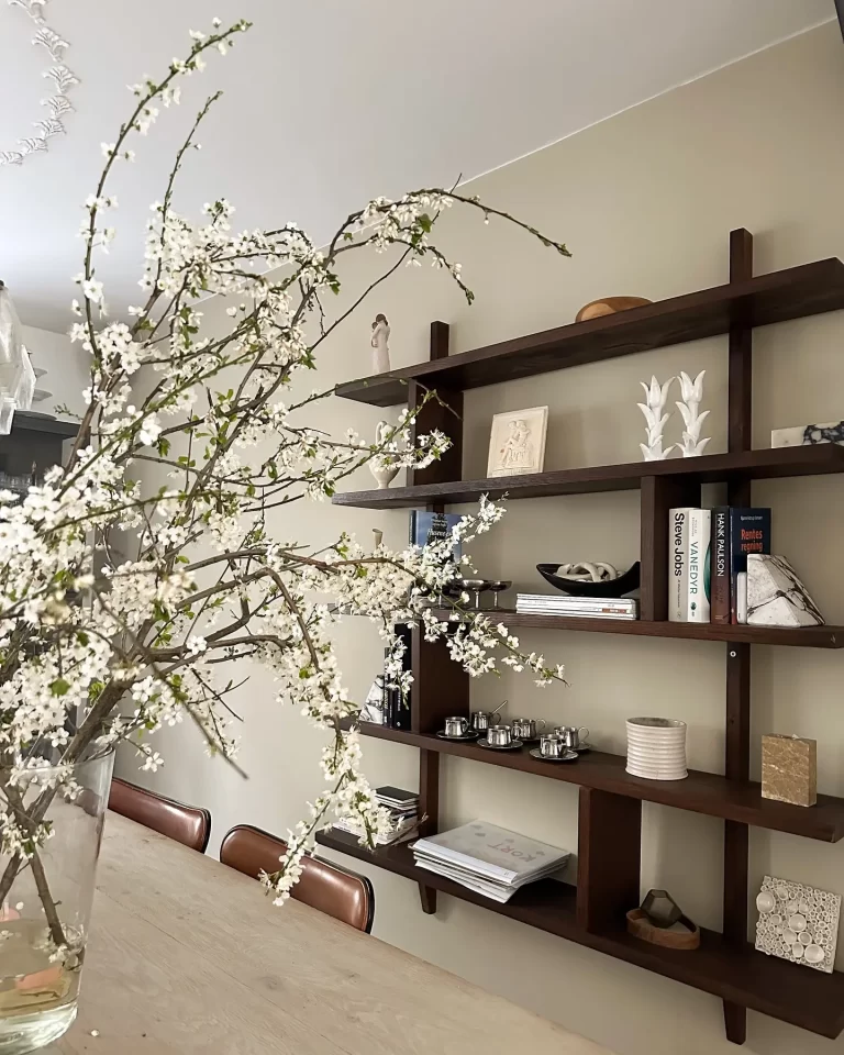 a perfectly accessorized shelf in a living space is both beautiful and functional, which makes it important to know how to avoid common mistakes when accessorizing shelves and bookcases