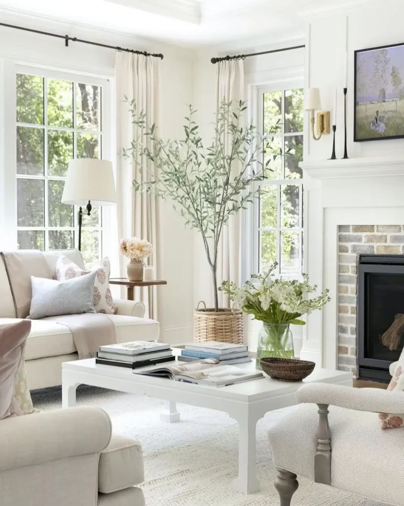 airy, bright, and a touch of greenery make this living room decor ready for the long summer days.