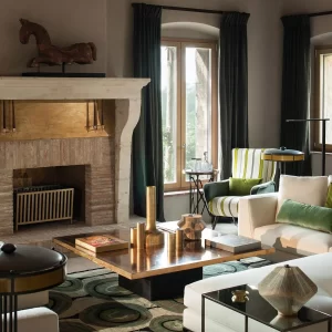 metallic decor can be used as a focal point if done right such as a bronze coffee table that is styled with other metal items in a living room with modern rustic decor.