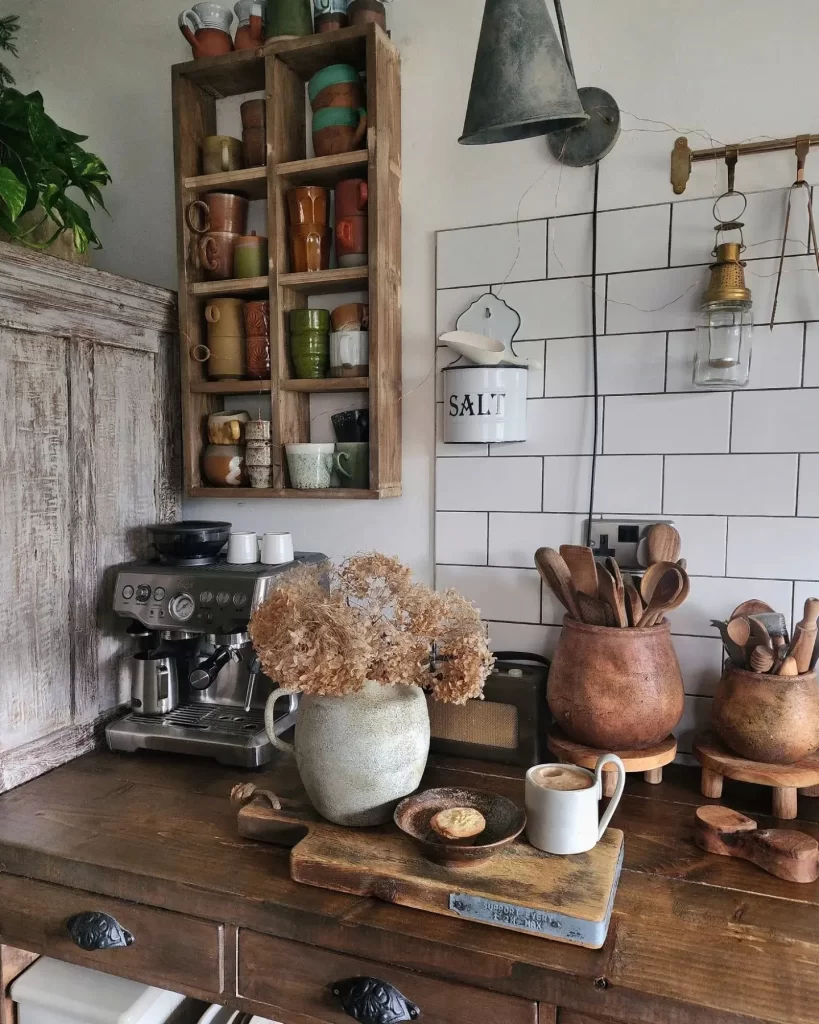 a stainless steel coffee machine in a cottage kitchen is another way to blend the old with the new by adding a modern appliance into a rustic decor.