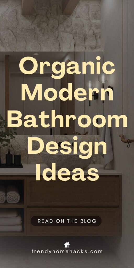 Pinterest pin with text overlay that reads "Organic Modern Bathroom Design Ideas" above an elegant Organic Modern Bathroom featuring a wooden vanity, stone wall, plush towels, and wall-mounted lights.