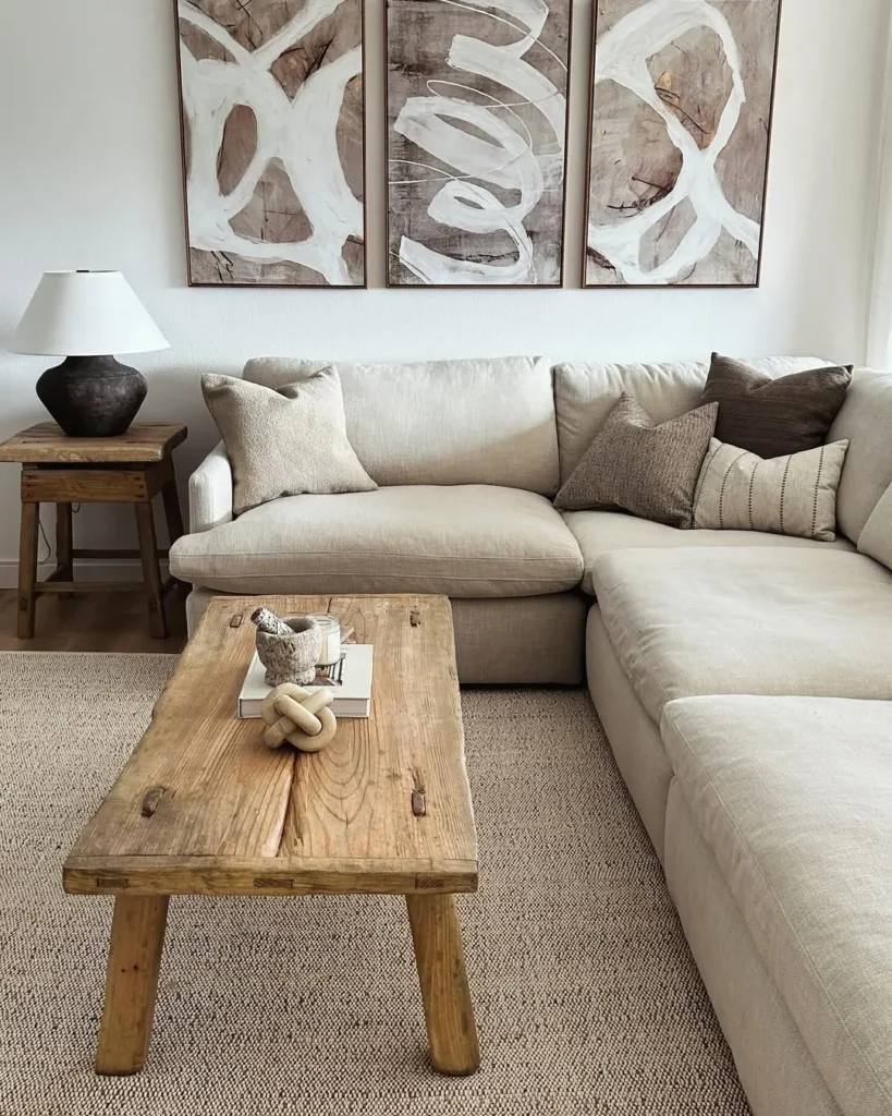 natural materials like wood and neutral colors along with curvy lines make this living room serene and reminiscent of organic modern interior style