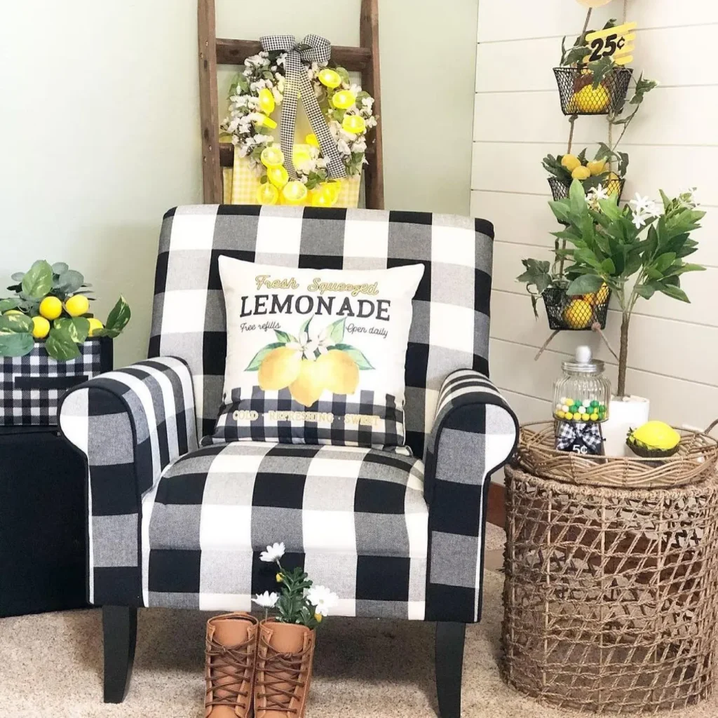 a sofa upholstered in buffalo check tabric and matching wreath along with lemons as part of decor make this interior perfect to welcome the summer season