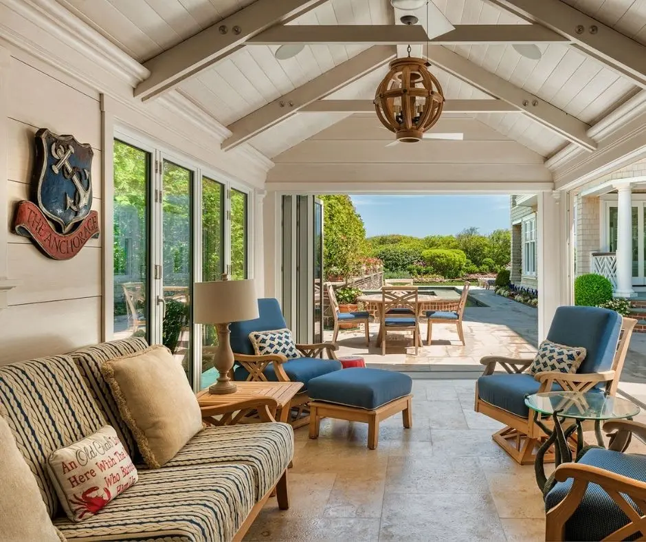 A coastal color palette brings a seaside aesthetic to this patio in additin to using natural wood finishes and nautical touches