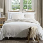 linen bedding in neutral colors work well in any season and particularly in the summer season to bring a fresh look to any bedroom decor