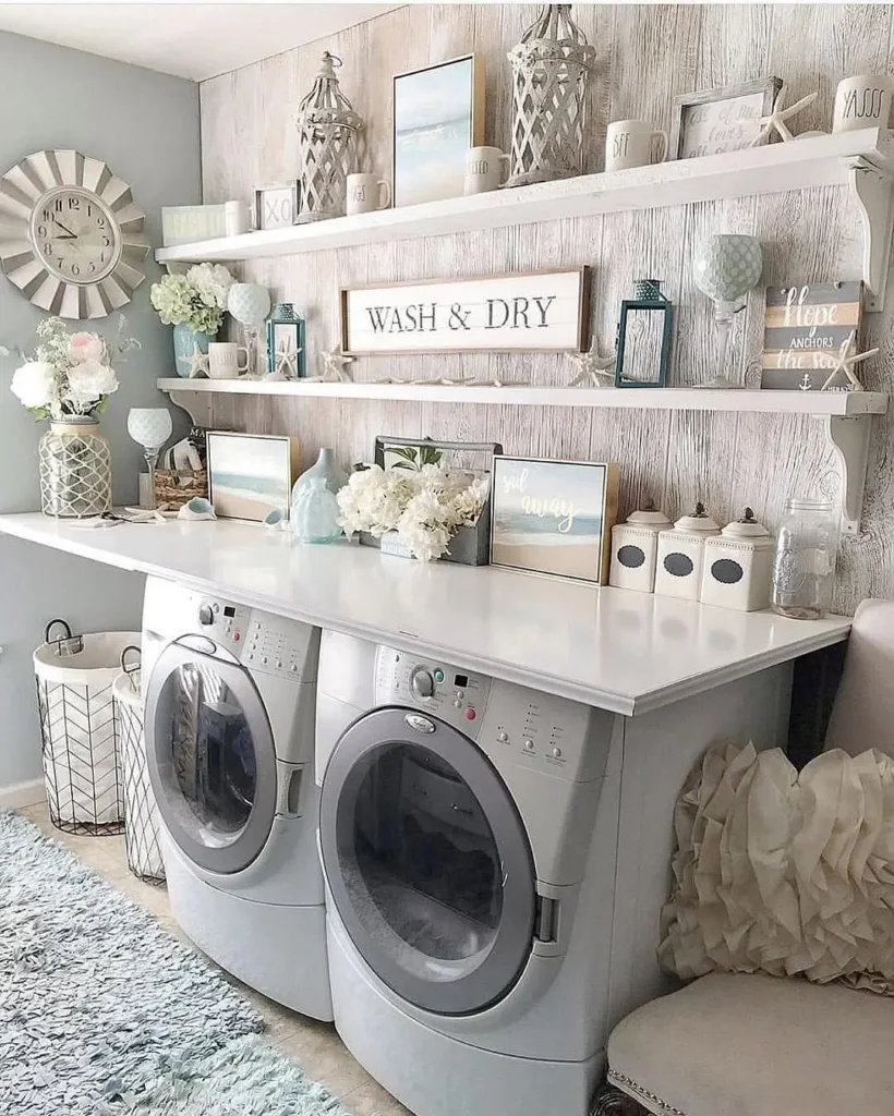 a laundry room with countertop and coastal inspired decor elements such as wall art, jars, and florals