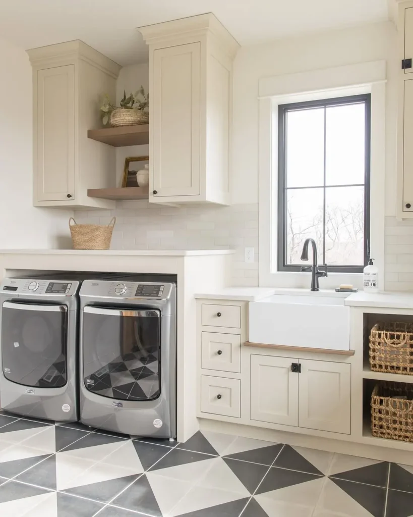 a laundry room with lots of storage, in neutral tone and minimal decoration in addition to smart appliances are some of the hallmark of a modern sleek laundry room as displayed in this space