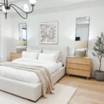 furniture with clean lines and a neutral color palette accented with wooden nightstands are primary organic modern elements that make this bedroom feel airy and calm