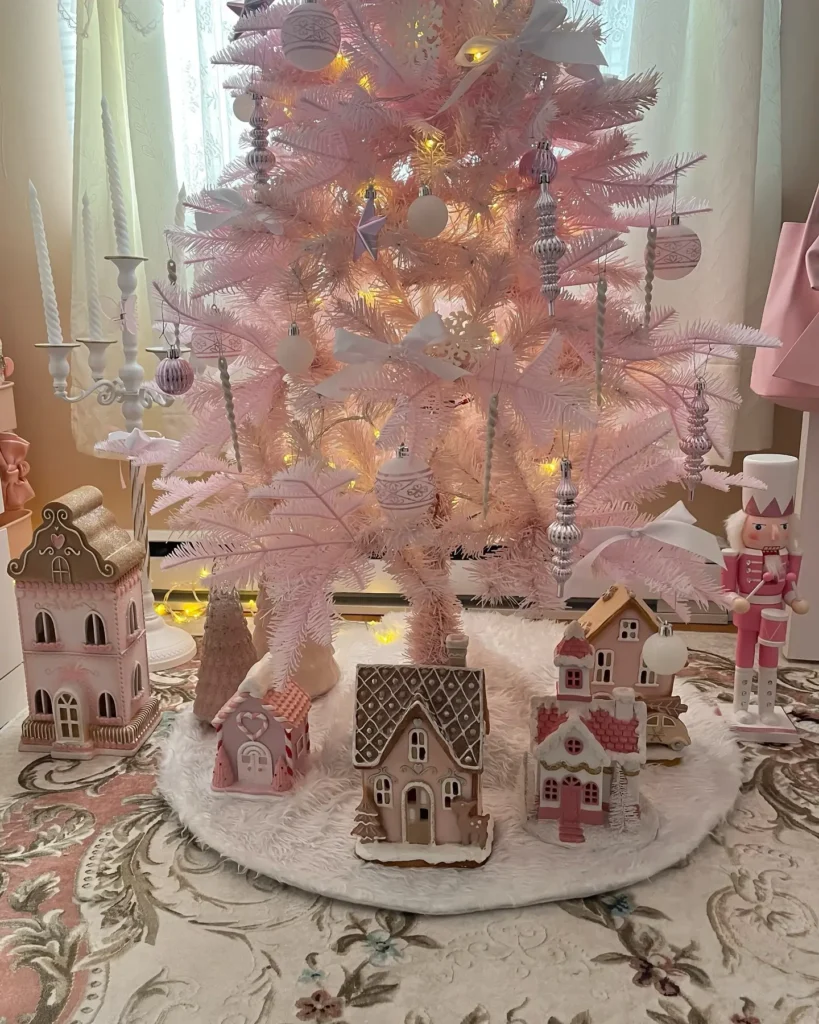 this coquette inspired pink christmas tree and small houses decor accents blend seamlessly within this themed-bedroom