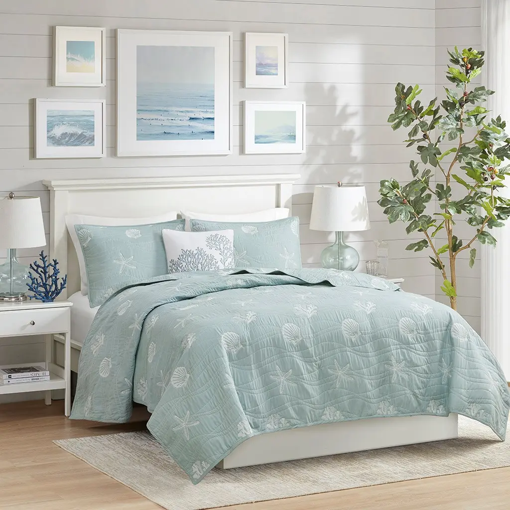 light and airy summer bedroom can be achieved with the right bedding and what better than a coastal-inspired hue like a light green to revamp the room