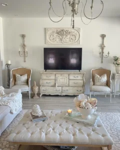 vintage living room furniture such as these chair and chest of drawers add to the french country feel of this space seamlessly