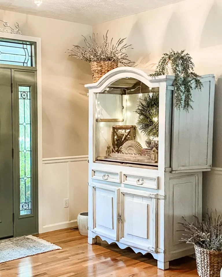 the use of whitewash furniture is a quick way to turn this entryway ready for the summer beach look along with greenery and coastal decor accents