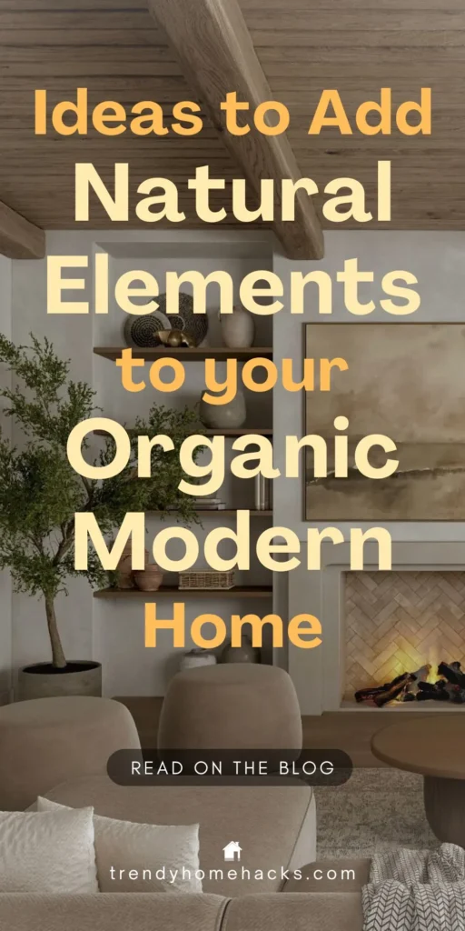 Cozy organic modern living room featuring a neutral-toned sofa, natural wood ceiling beams, built-in shelves with ceramics and decor, and a fireplace with herringbone brick detail. A large indoor plant adds greenery. Text overlay reads: 'Ideas to Add Natural Elements to Your Organic Modern Home.