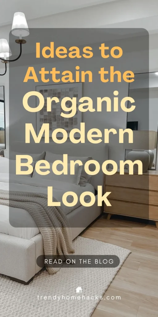 A cozy, minimalist bedroom featuring a neutral color palette with a light upholstered bed, layered white bedding, a chunky knit throw, wood nightstand with a ceramic lamp, and modern wall art. Text on image reads “Ideas to Attain the Organic Modern Bedroom Look.”