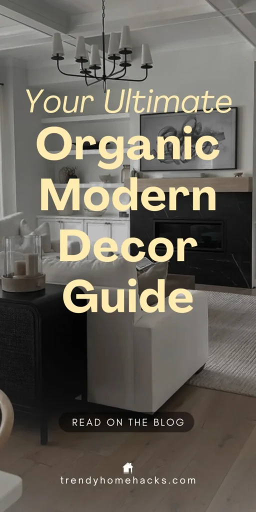 Living room with modern organic decor featuring a white armchair, black fireplace, and neutral tones. Perfect Pinterest pin with text overlay: "Your Ultimate Organic Modern Decor Guide.