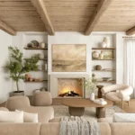 An organic modern living room with neutral tones, natural elements, a lit fireplace, wooden beams, open shelves with decor, a round table, and contemporary seating.