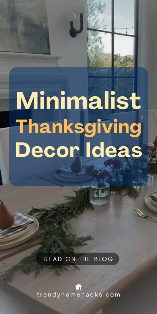Minimalist Thanksgiving table setting with cedar garland, taper candles, white plates, and simple glass vases with orange flowers. Text overlay reads “Minimalist Thanksgiving Decor Ideas.”