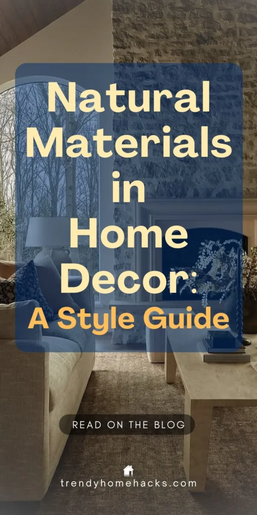 Elegant living room with stone fireplace, neutral furniture, and natural materials like a travertine coffee table and linen-upholstered sofa. Text overlay reads “Natural Materials in Home Decor: A Style Guide.”